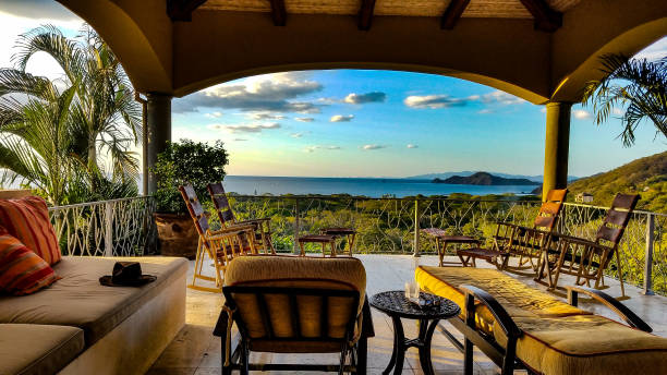 A relaxing patio over looking the pacifc ocean at sunset.