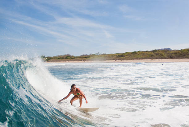 young woman surfing