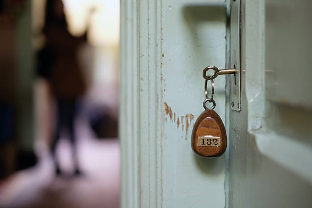 Boutique hotel rooms key on the door.