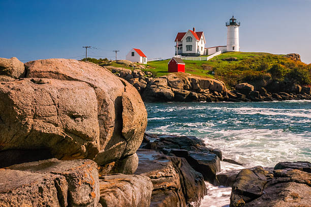 Cape Neddick lighthouse is located on a small island , Tne Nubble, off the coast of York, Maine.