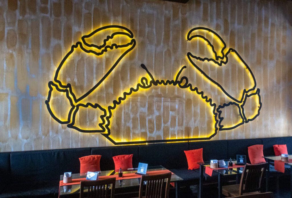 the logo for the tuna and the crab restaurant located in the old dutch hospital building in galle fort galle sri lanka